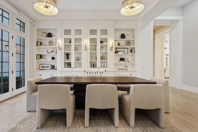 a kitchen with kitchen island a sink and a stove with wooden floor