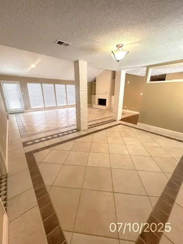 a large kitchen with stainless steel appliances granite countertop a stove a sink dishwasher and a refrigerator