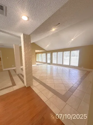 a bathroom with a sink mirror and shower