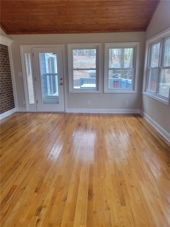 3370 Westbrook Road Suwanee, GA 30024 - Photo 11 of 43 a view of an empty room with wooden floor and a window
