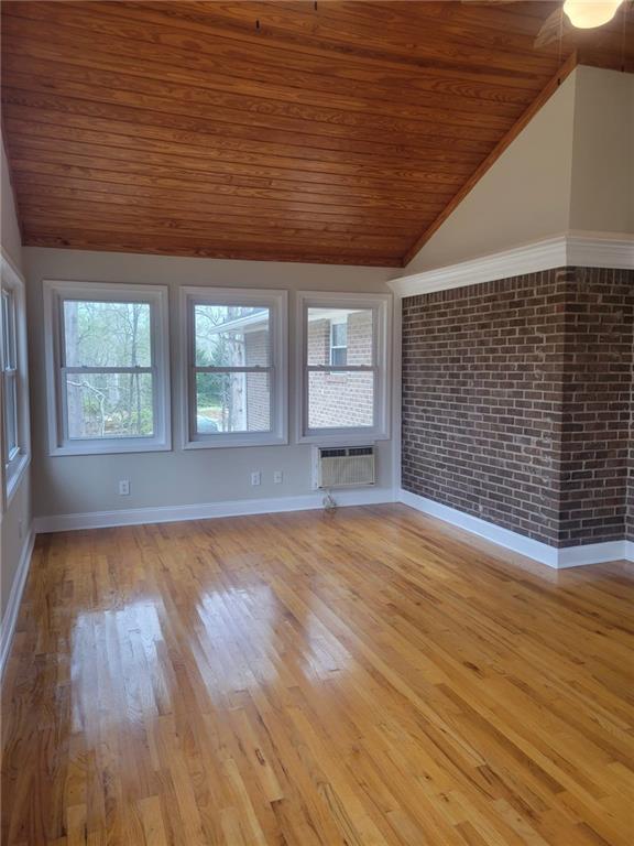 3370 Westbrook Road Suwanee, GA 30024 - Photo 14 of 43 an empty room with wooden floor and windows