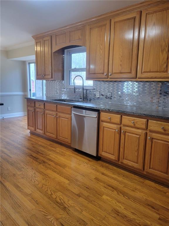 3370 Westbrook Road Suwanee, GA 30024 - Photo 16 of 43 a kitchen with granite countertop wooden cabinets a sink and dishwasher