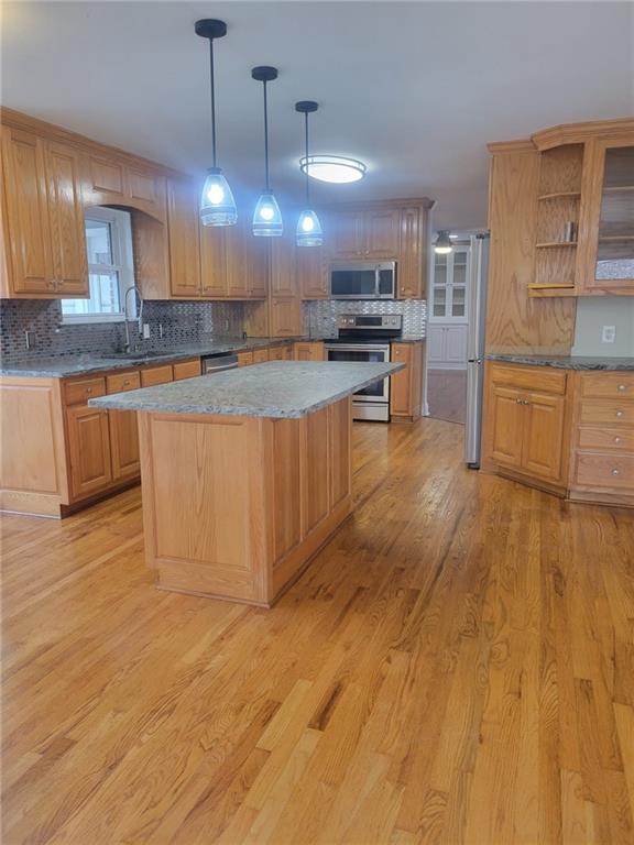 3370 Westbrook Road Suwanee, GA 30024 - Photo 17 of 43 a large kitchen with kitchen island a sink stainless steel appliances and cabinets