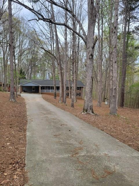 3370 Westbrook Road Suwanee, GA 30024 - Photo 2 of 43 a view of a outdoor space covered with snow in the front of the house