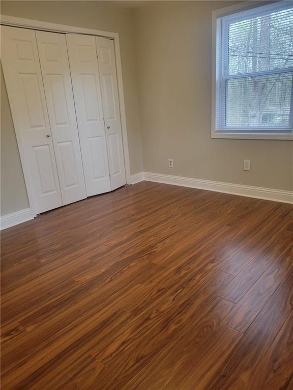 3370 Westbrook Road Suwanee, GA 30024 - Photo 25 of 43 a view of an empty room with wooden floor