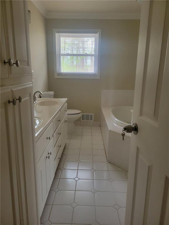 3370 Westbrook Road Suwanee, GA 30024 - Photo 27 of 43 a bathroom with a granite countertop sink a toilet and a bathtub