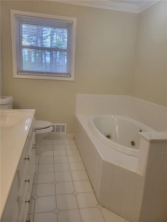 3370 Westbrook Road Suwanee, GA 30024 - Photo 28 of 43 a bathroom with a bathtub