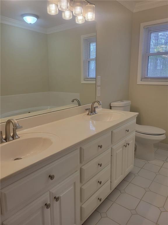 3370 Westbrook Road Suwanee, GA 30024 - Photo 29 of 43 a bathroom with a double vanity sink a toilet and a mirror
