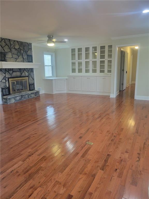 3370 Westbrook Road Suwanee, GA 30024 - Photo 36 of 43 a view of empty room with wooden floor and fireplace