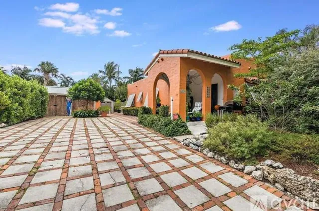 a kitchen with granite countertop a sink and a window
