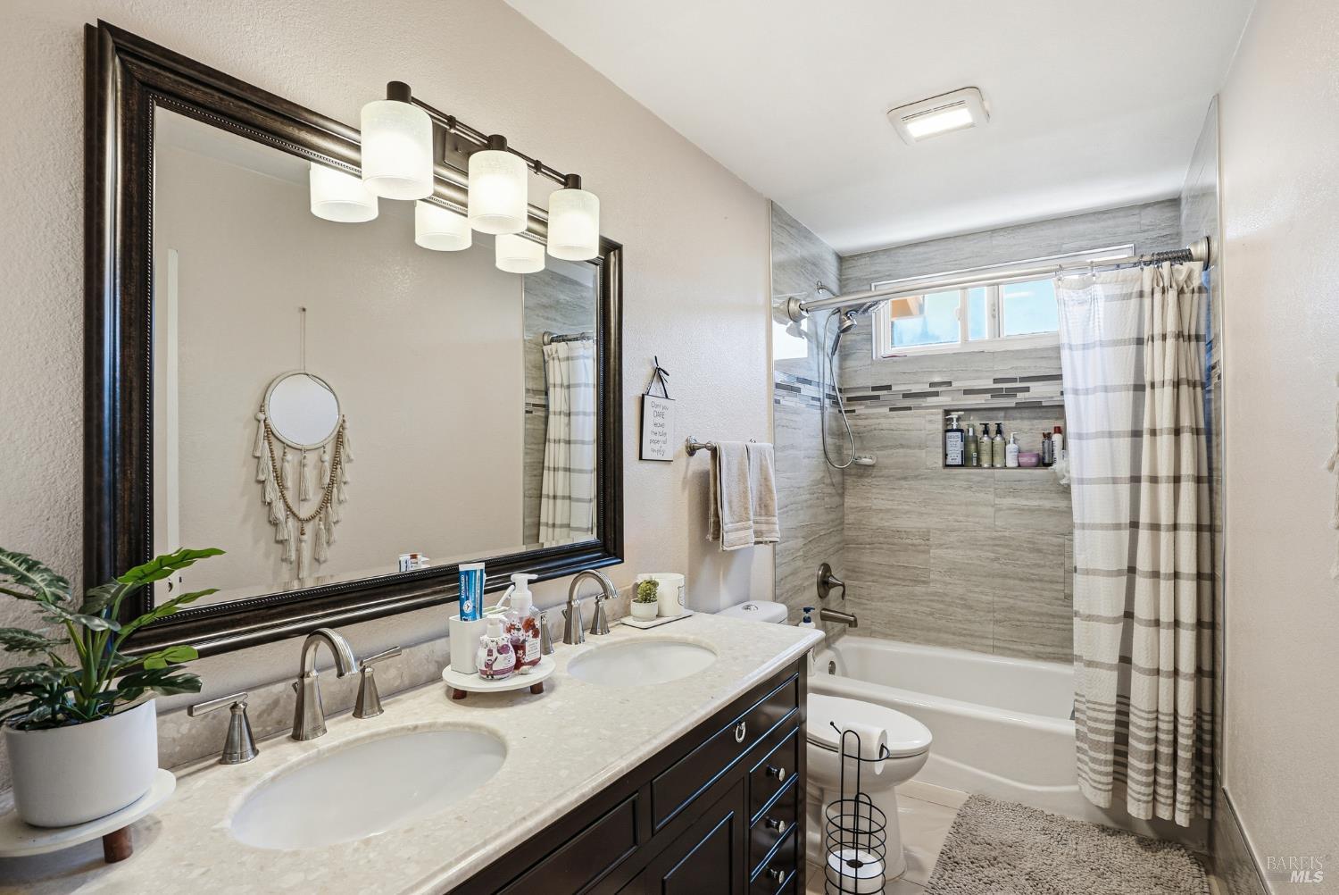773 Blue Ridge Lane Vacaville, CA 95688 - Photo 28 of 44 a bathroom with a sink a double vanity and a mirror