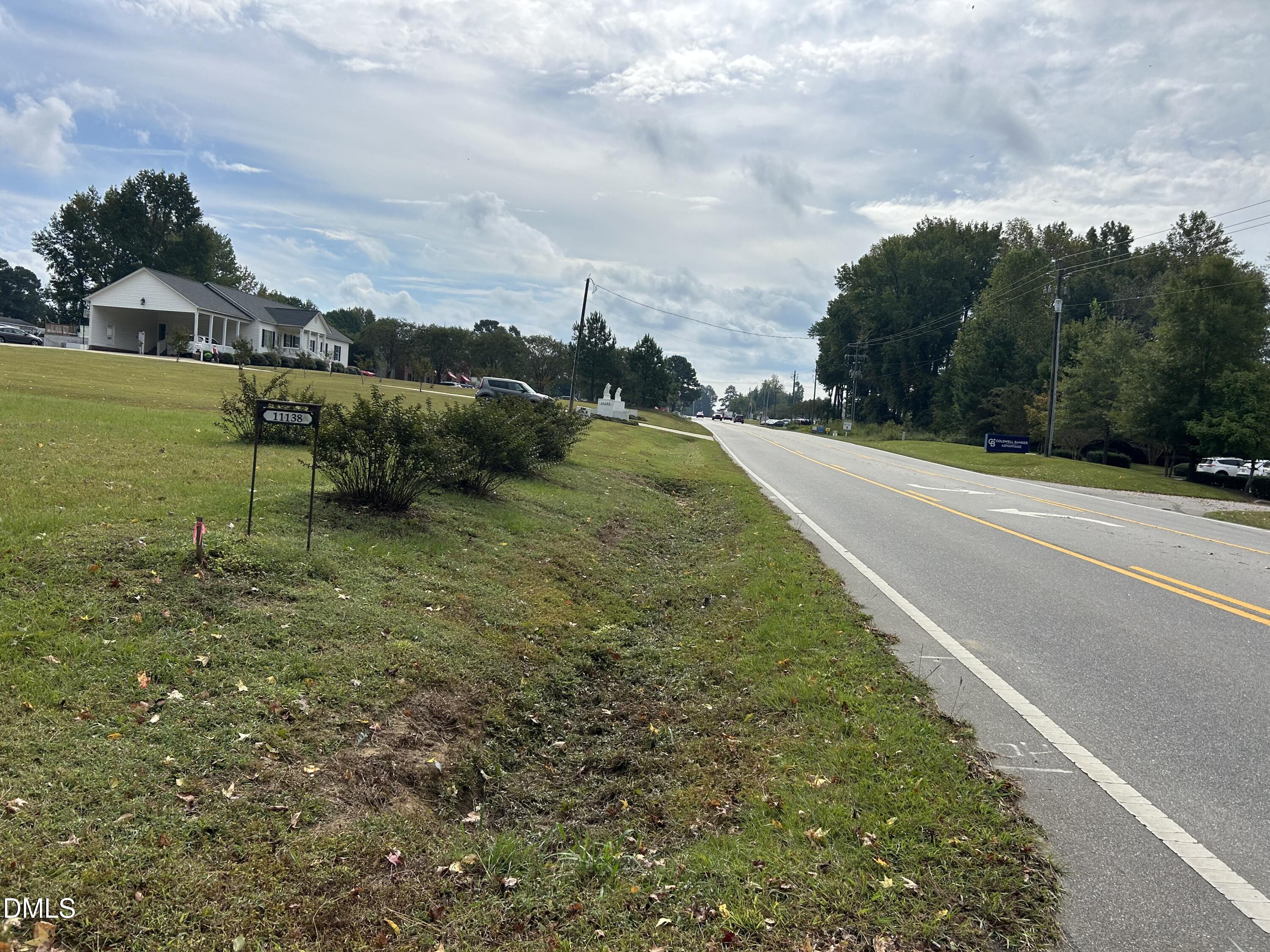 11114 Cleveland Road Garner, NC 27529 - Photo 14 of 26 a view of a green yard