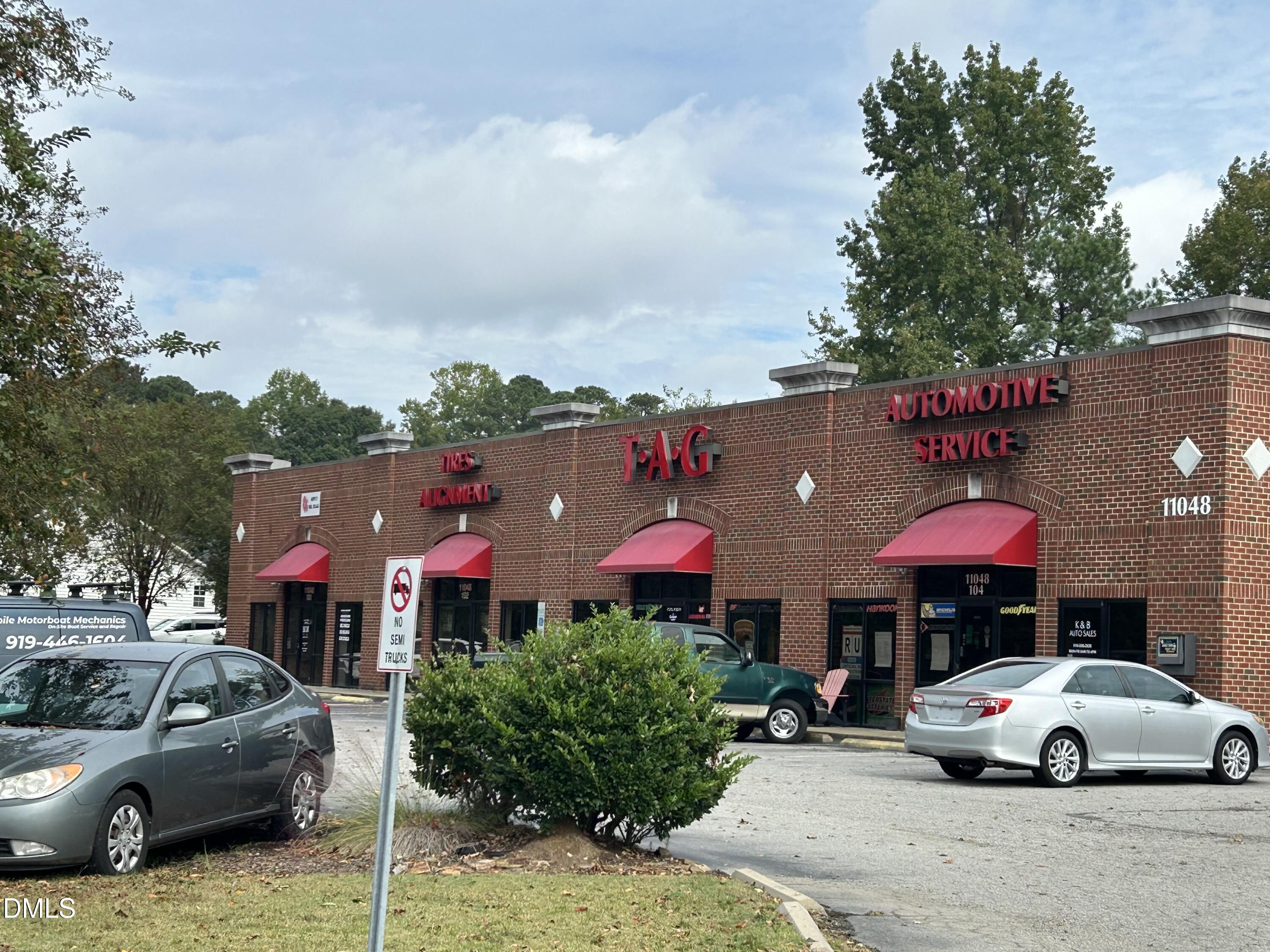 11114 Cleveland Road Garner, NC 27529 - Photo 18 of 26 a front view of a house with a yard and car parked
