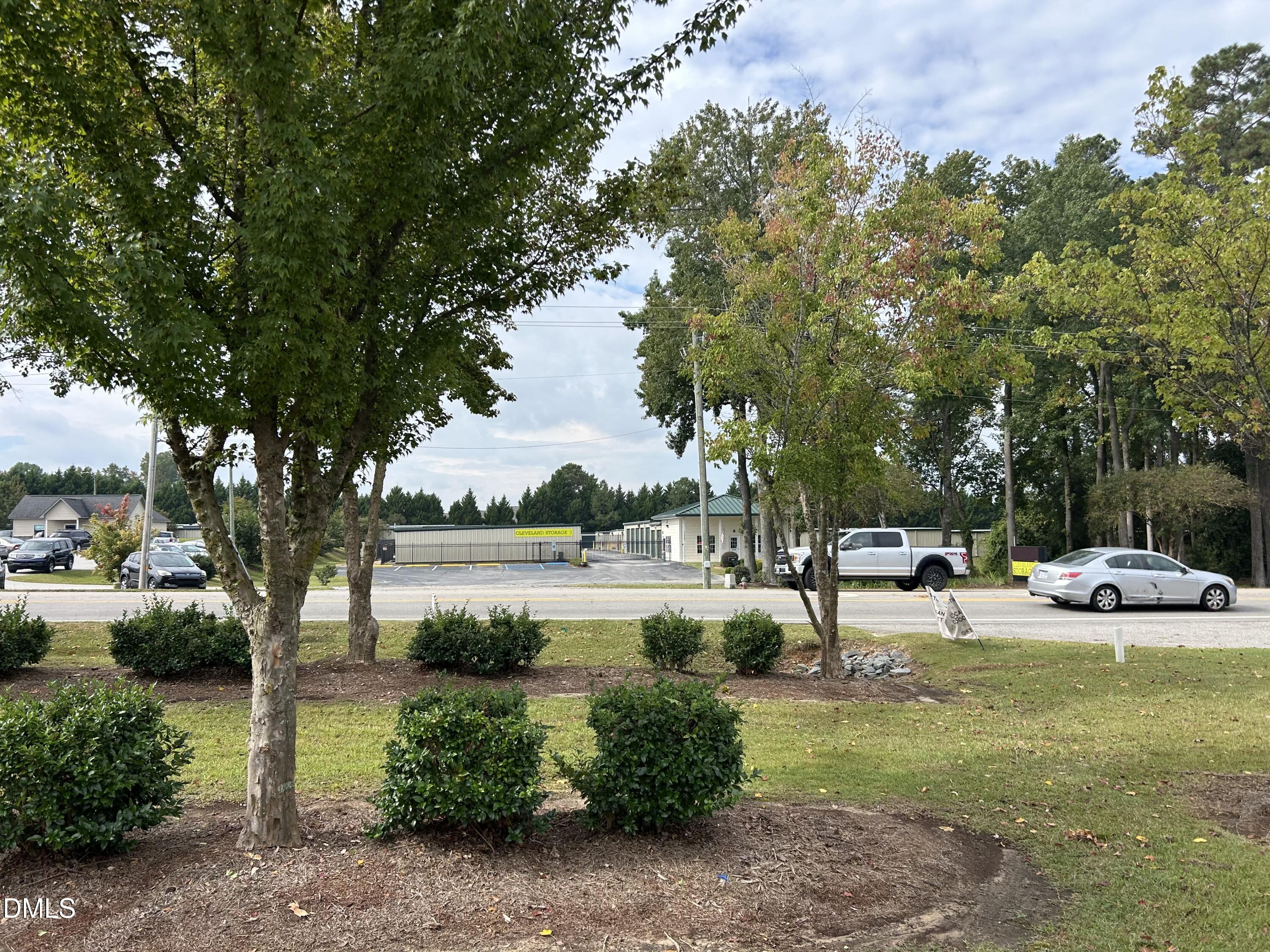 11114 Cleveland Road Garner, NC 27529 - Photo 19 of 26 a view of a garden with sitting area