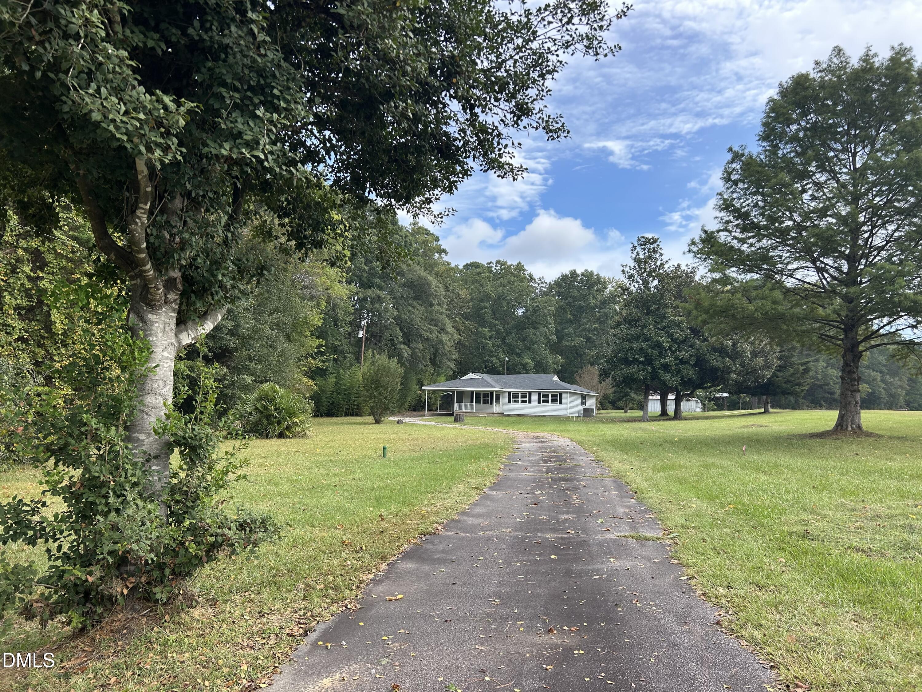11114 Cleveland Road Garner, NC 27529 - Photo 2 of 26 a view of a big yard with large trees