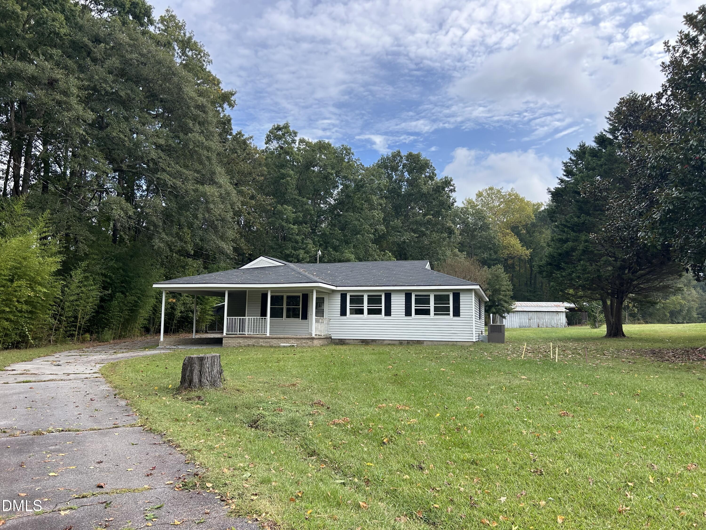 11114 Cleveland Road Garner, NC 27529 - Photo 3 of 26 a view of a house with a yard and sitting area