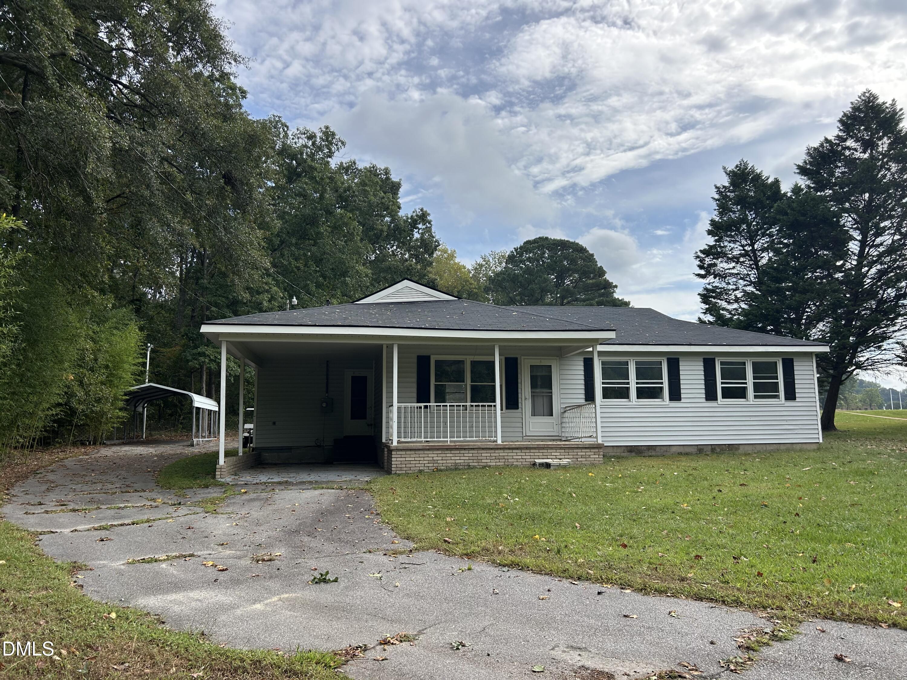 11114 Cleveland Road Garner, NC 27529 - Photo 5 of 26 front view of a house with a garden
