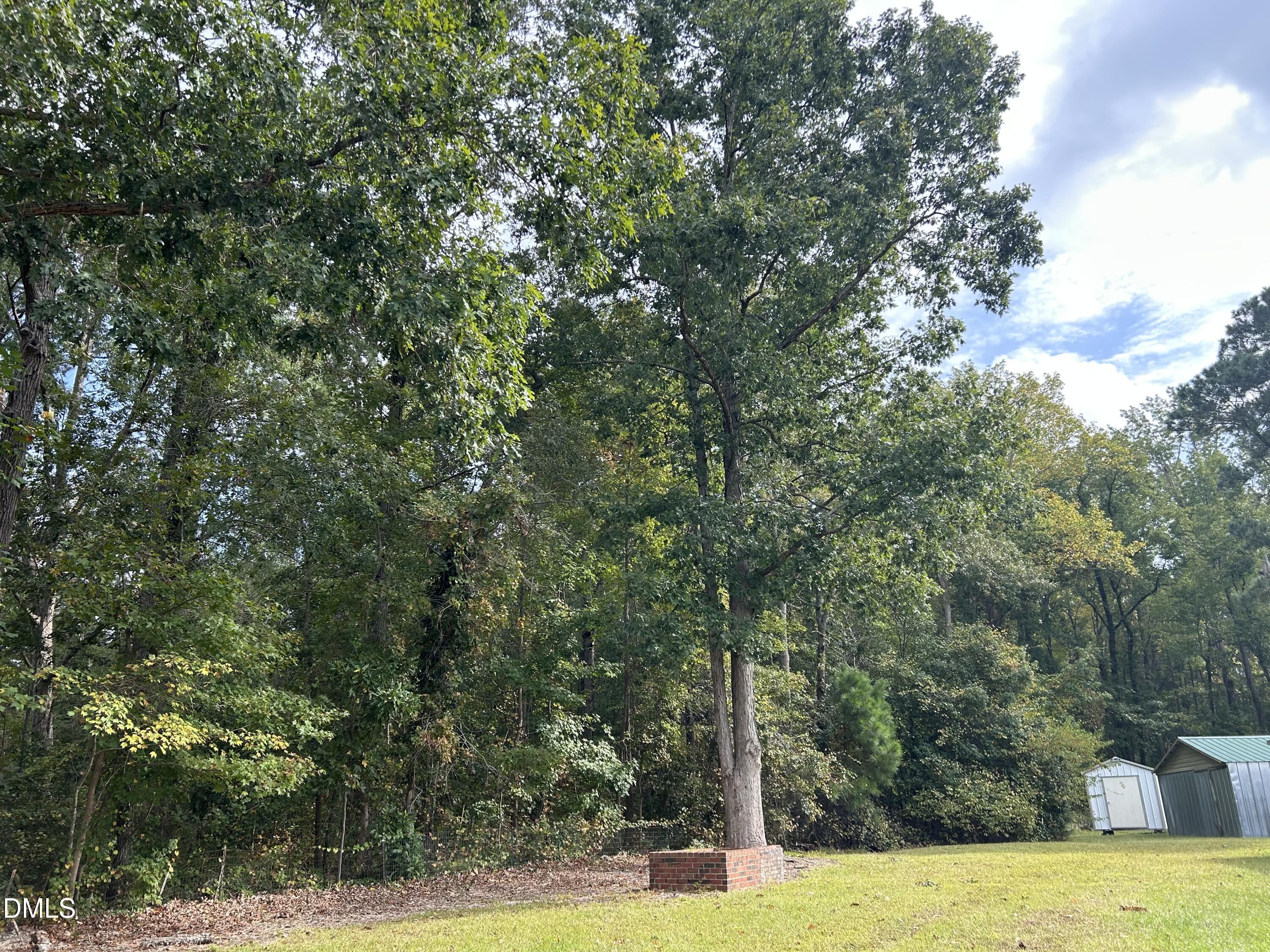 11114 Cleveland Road Garner, NC 27529 - Photo 7 of 26 a view of a swimming pool with an outdoor space and seating area