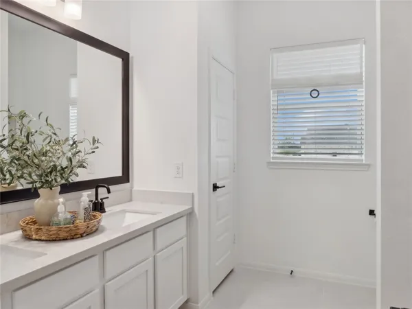 a bathroom with a sink and vanity