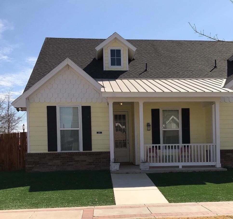 front view of a house with a yard