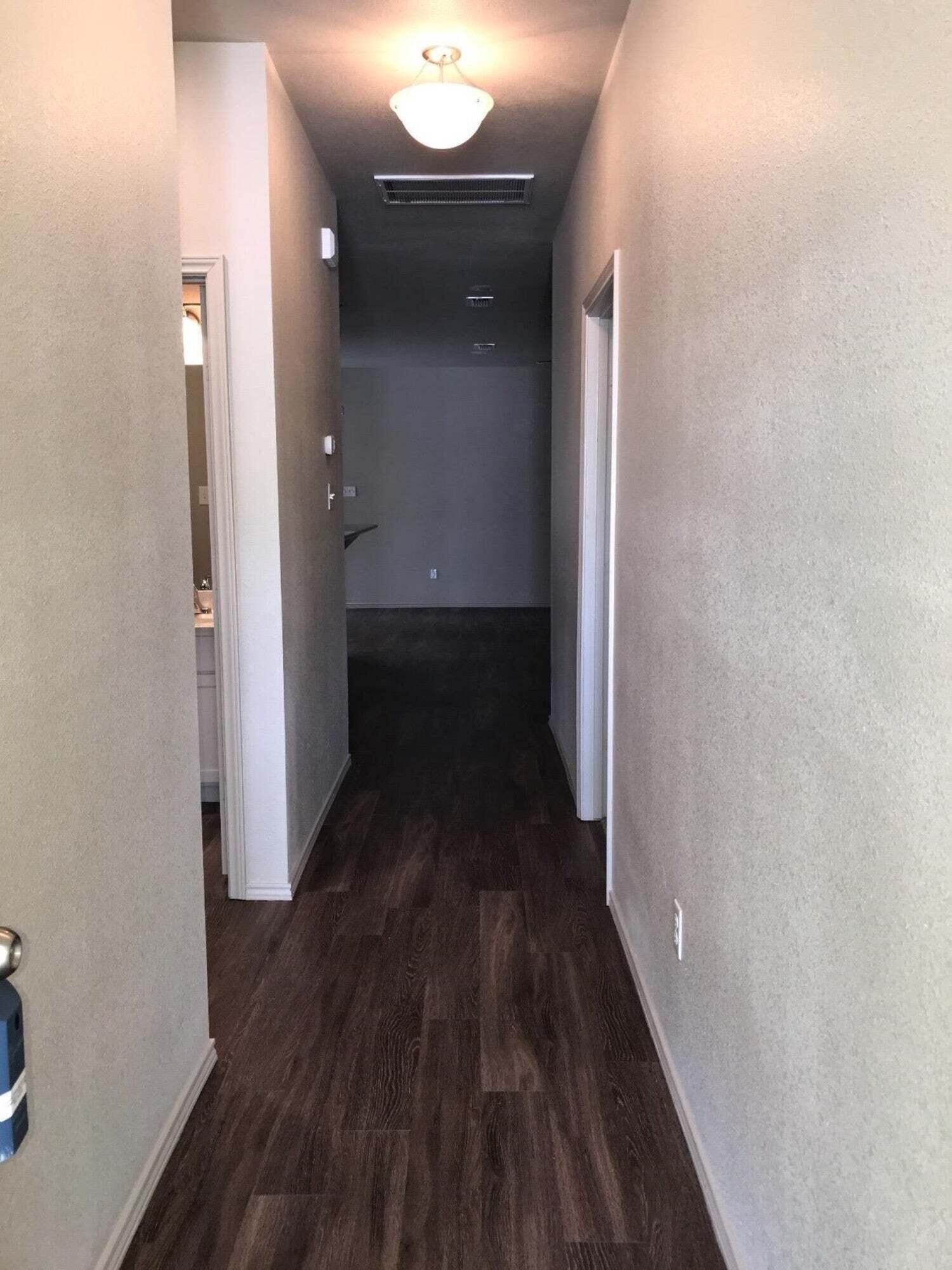 2101 10th Street Lubbock, TX 79401 - Photo 2 of 8 wooden floor in a gallery