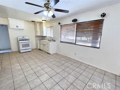 33671 Beverly Drive Hemet, CA 92545 - Photo 3 of 15 a large white kitchen with a sink cabinets and appliances