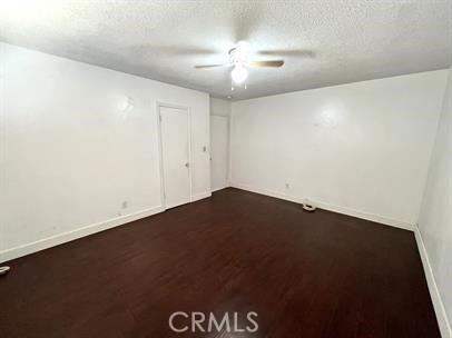 33671 Beverly Drive Hemet, CA 92545 - Photo 9 of 15 an empty room with a ceiling fan and a window