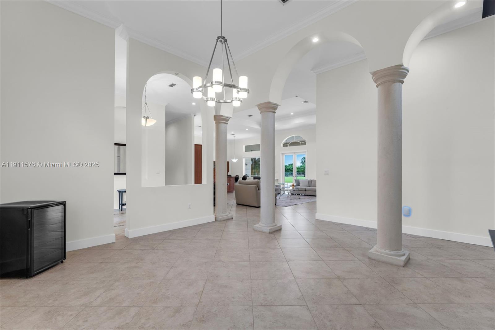 15050 Southwest 179th Avenue Miami, FL 33196 - Photo 14 of 46 a view of a livingroom with a chandelier