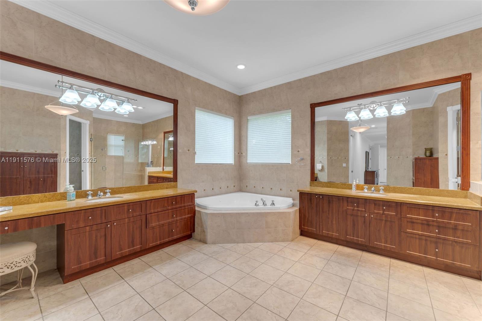 15050 Southwest 179th Avenue Miami, FL 33196 - Photo 18 of 46 a large bathroom with a large tub and sink