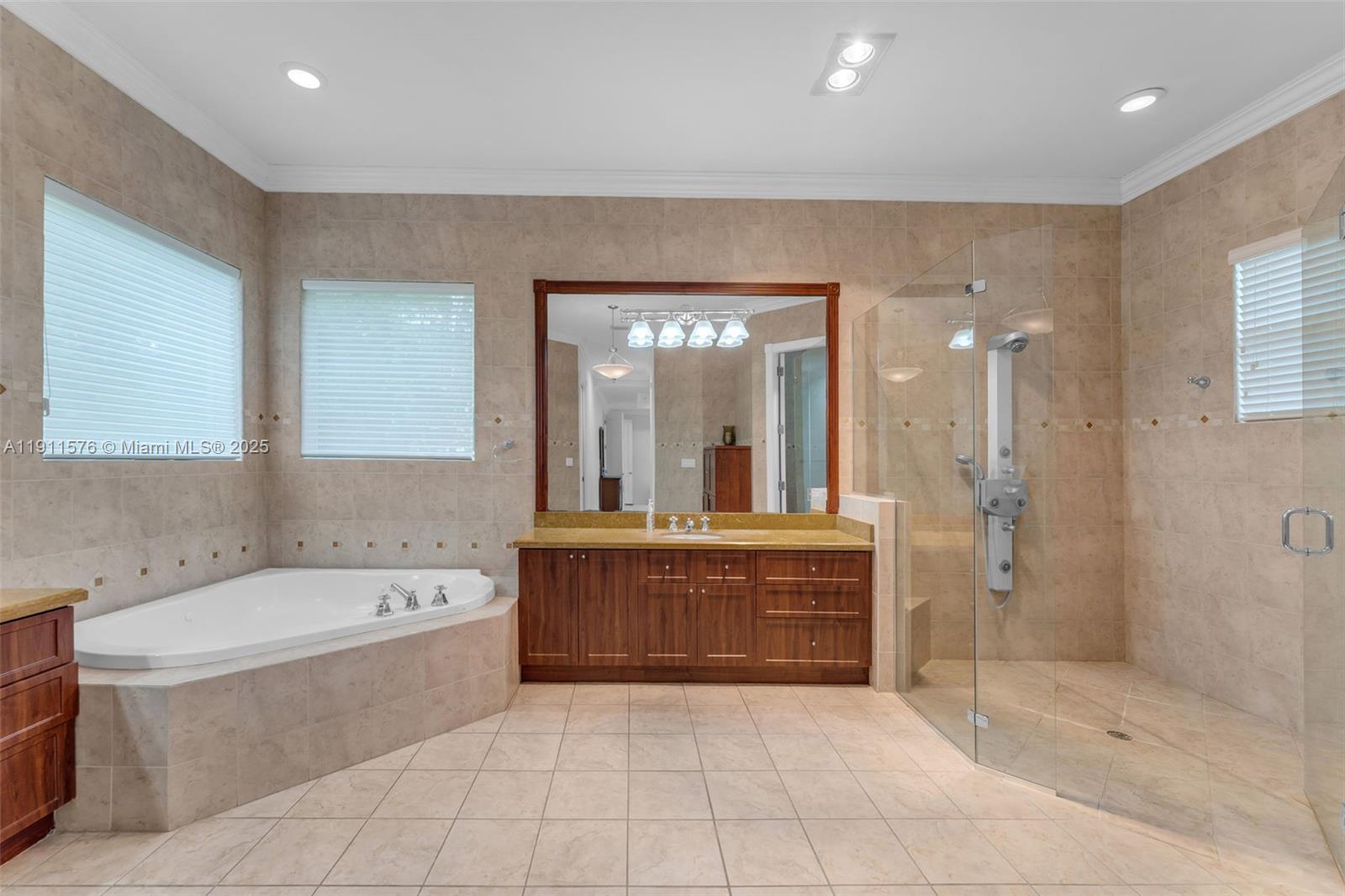 15050 Southwest 179th Avenue Miami, FL 33196 - Photo 19 of 46 a large spacious bathroom with a tub shower and sink