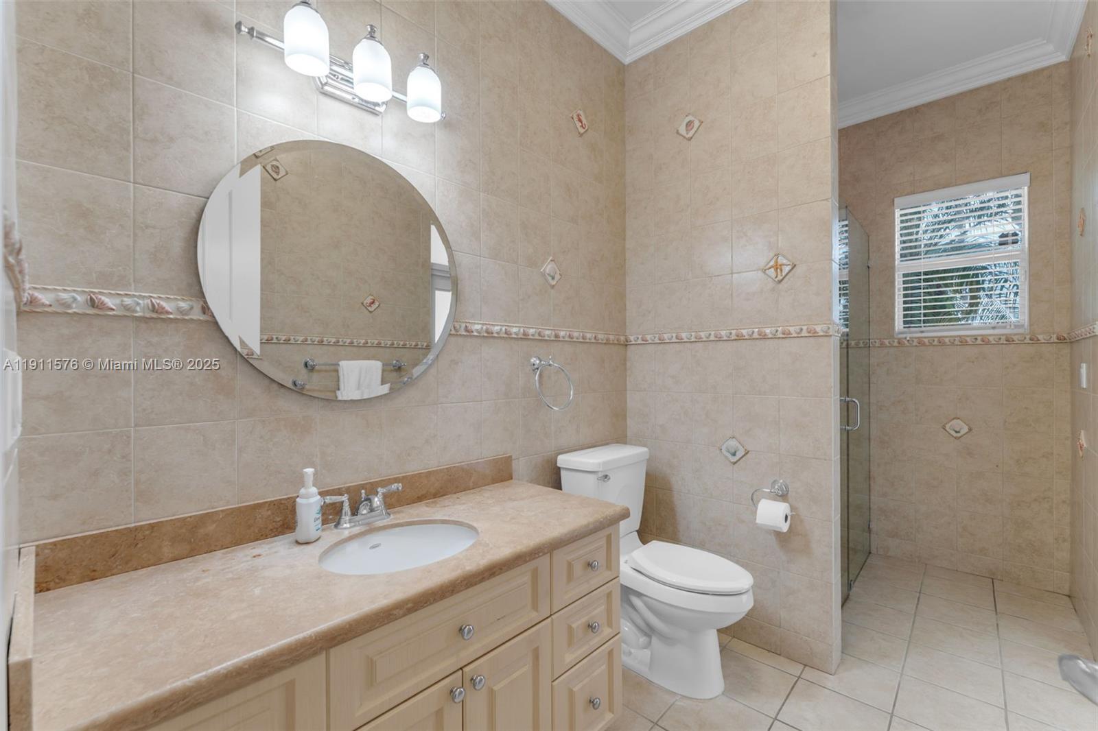 15050 Southwest 179th Avenue Miami, FL 33196 - Photo 24 of 46 a bathroom with a granite countertop toilet a sink and a mirror