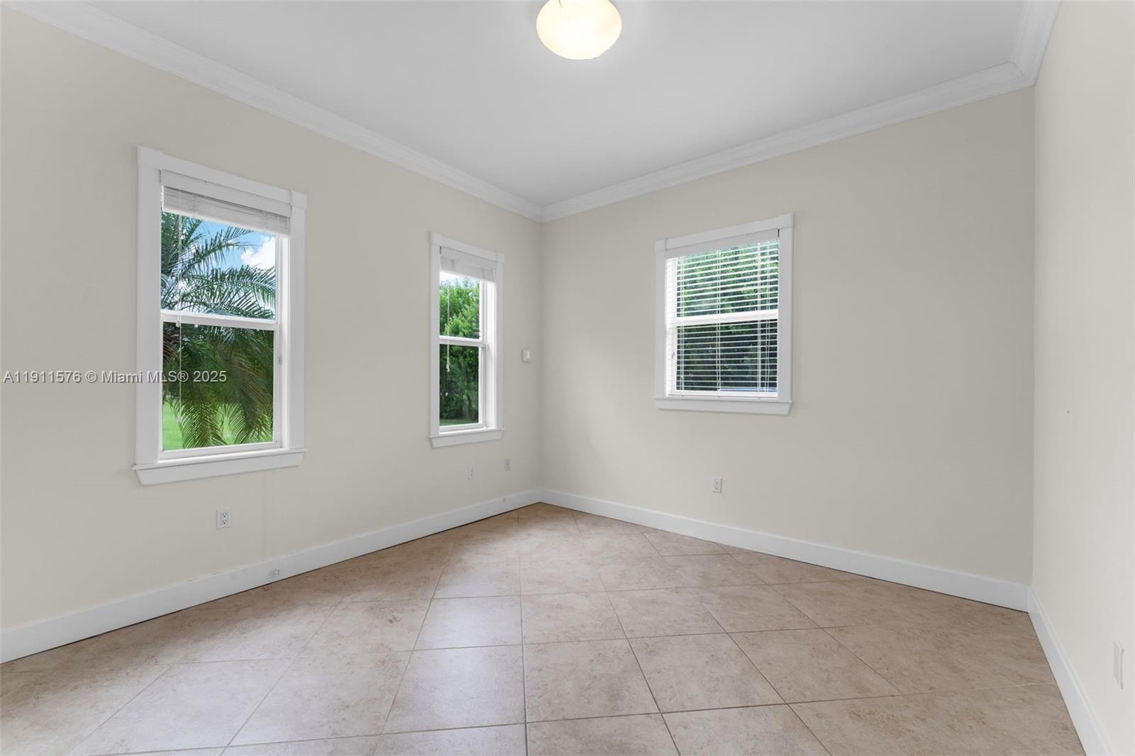 15050 Southwest 179th Avenue Miami, FL 33196 - Photo 25 of 46 an empty room with windows