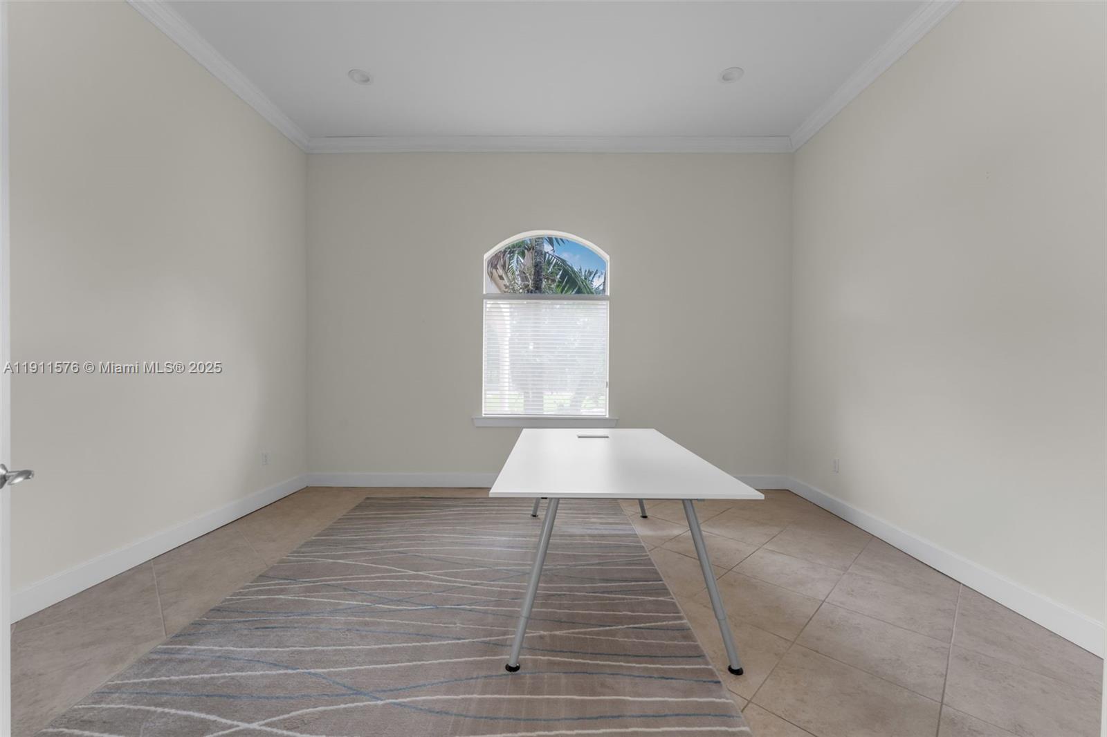 15050 Southwest 179th Avenue Miami, FL 33196 - Photo 27 of 46 an empty room with wooden floor and windows