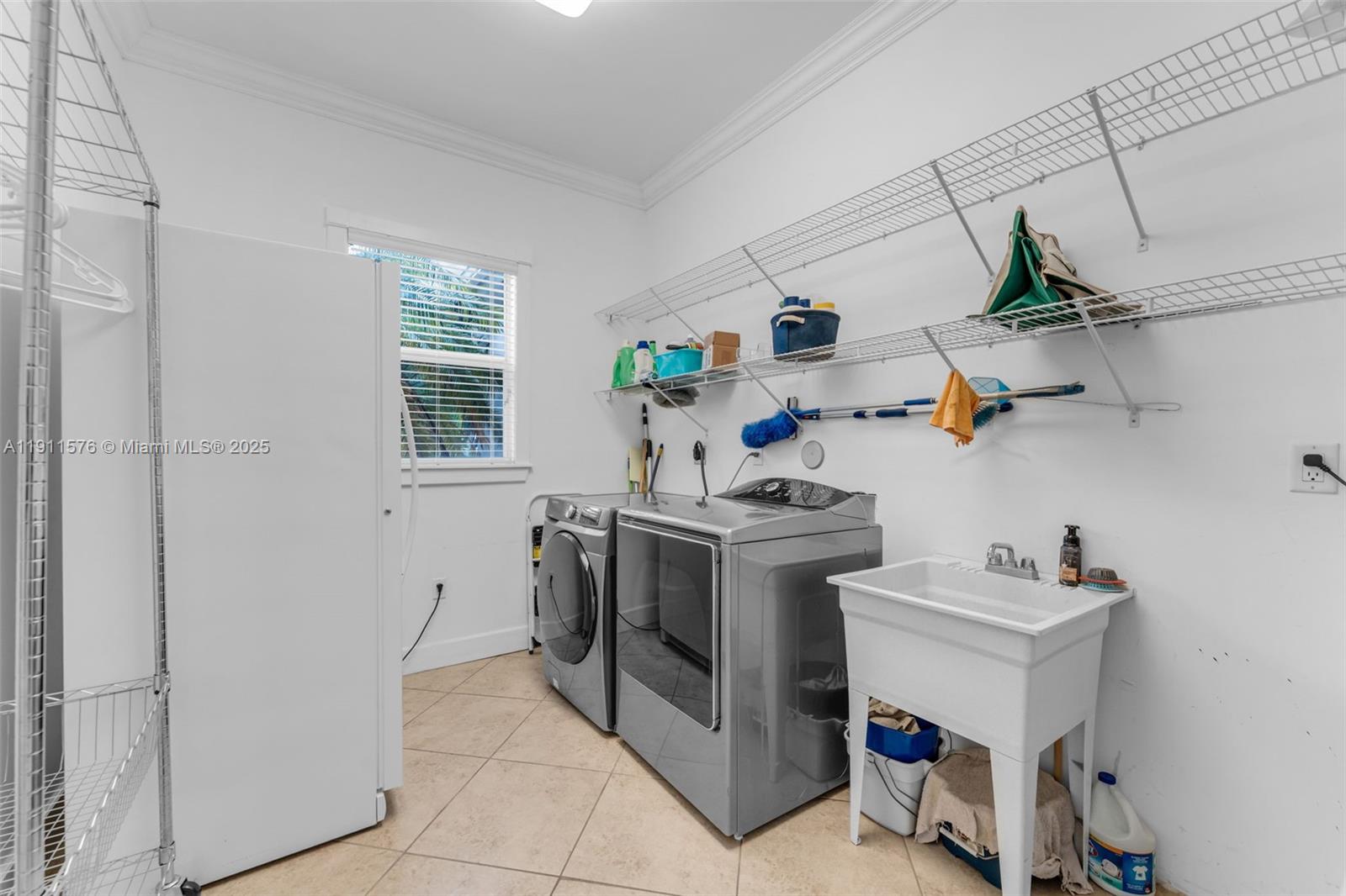15050 Southwest 179th Avenue Miami, FL 33196 - Photo 28 of 46 a utility room with sink dryer and washer