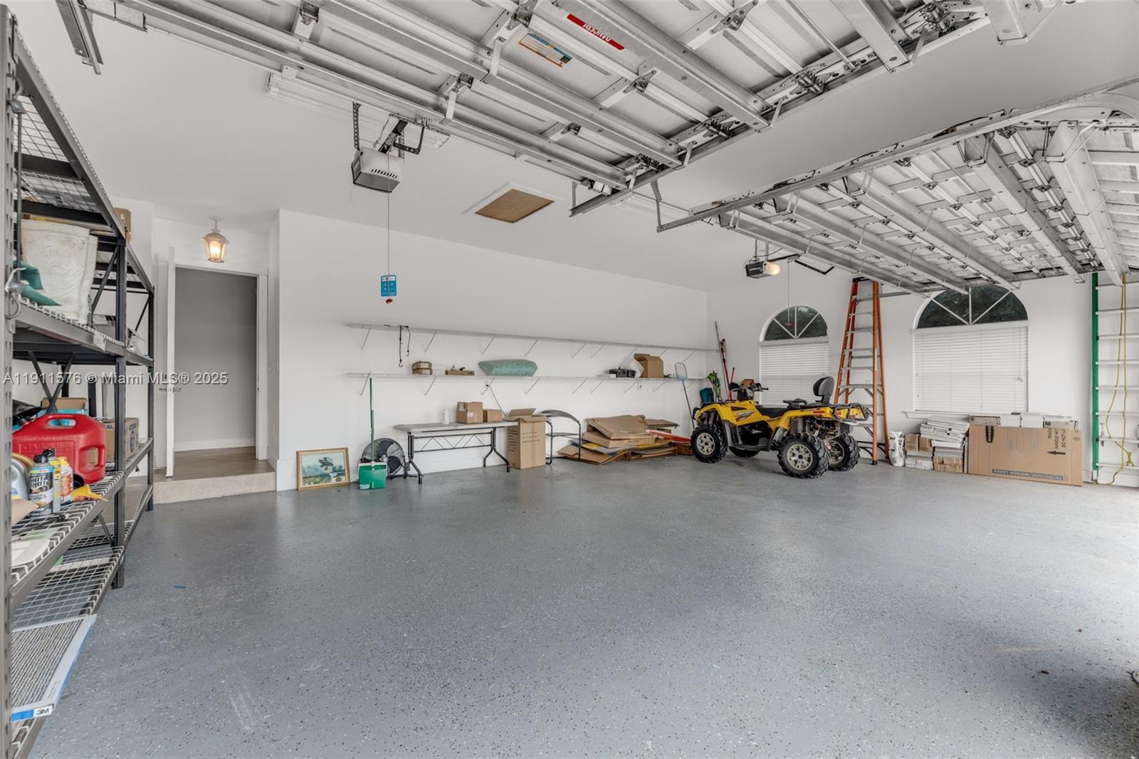 15050 Southwest 179th Avenue Miami, FL 33196 - Photo 29 of 46 a view of a garage with a bike and car