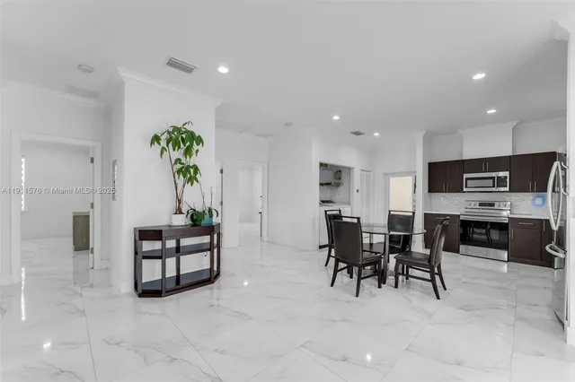 a view of kitchen with microwave and cabinets