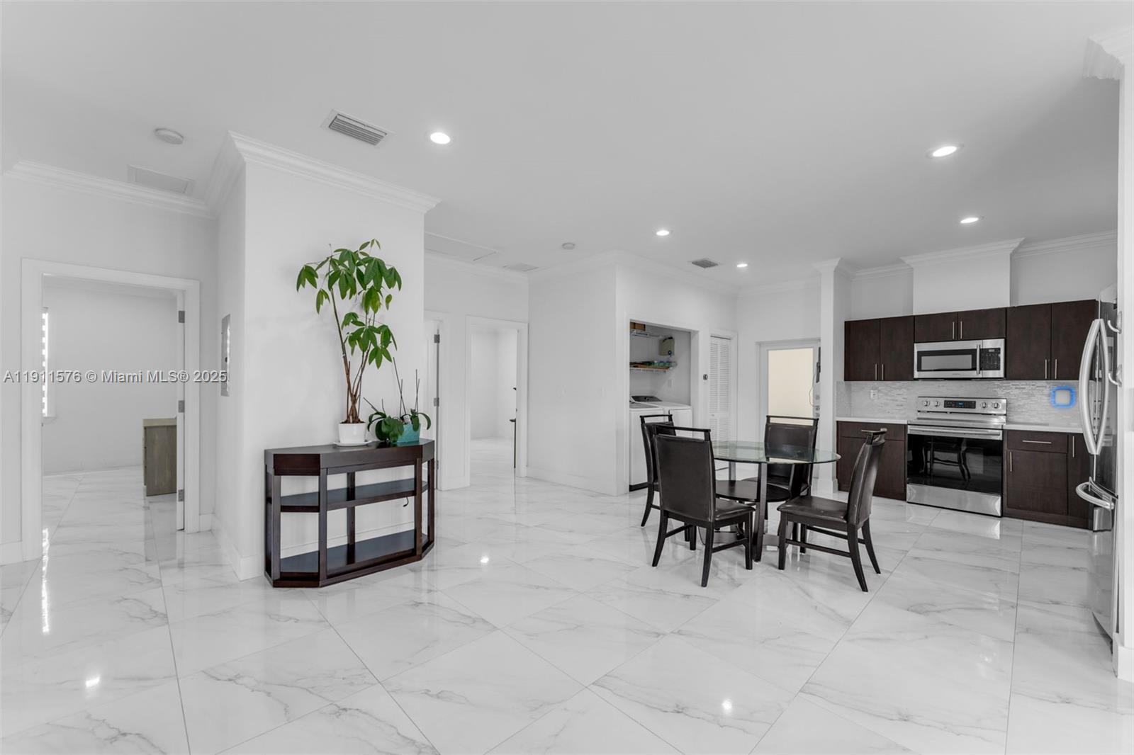 15050 Southwest 179th Avenue Miami, FL 33196 - Photo 34 of 46 a view of kitchen with microwave and cabinets