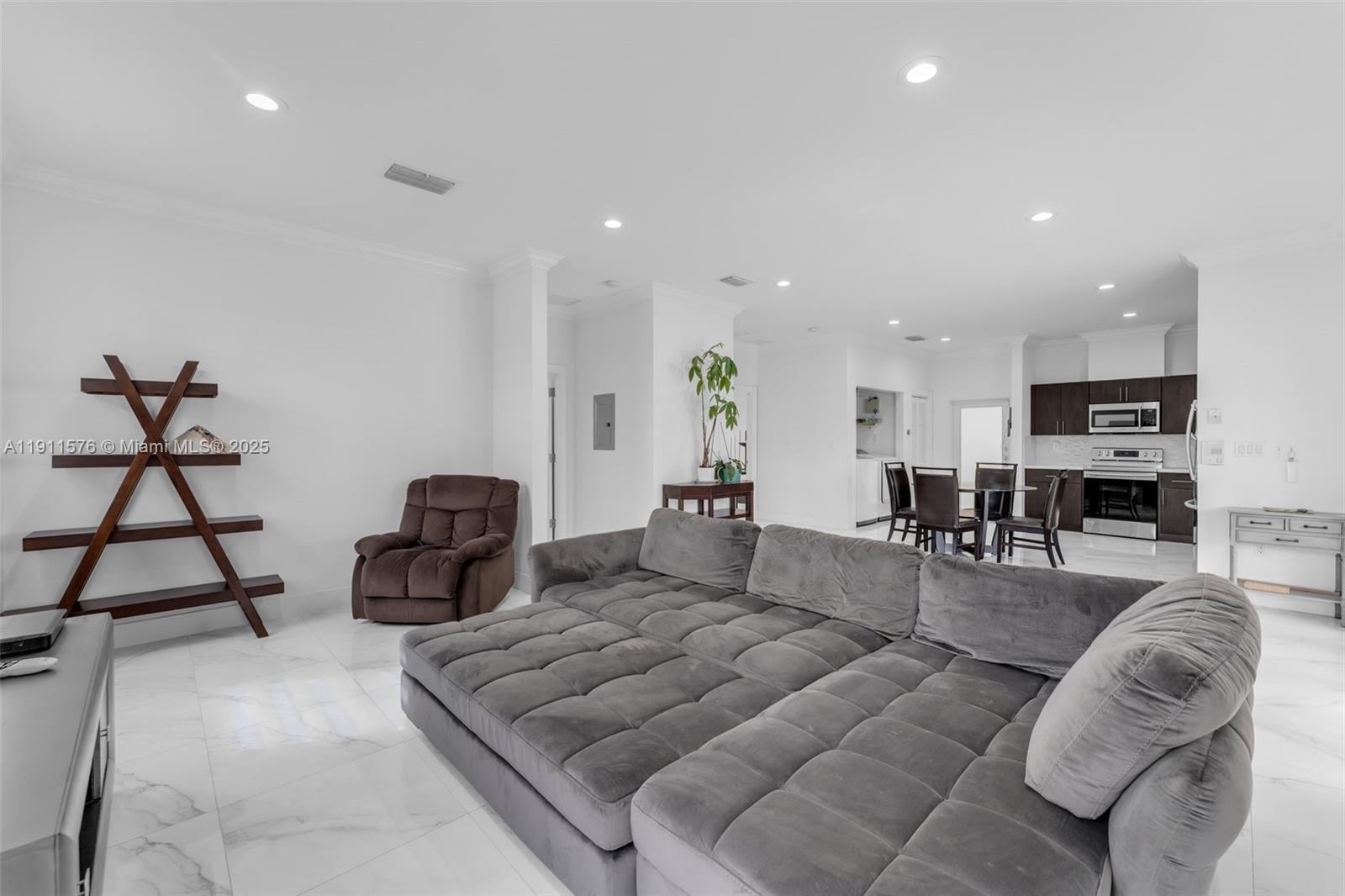 15050 Southwest 179th Avenue Miami, FL 33196 - Photo 36 of 46 a living room with furniture