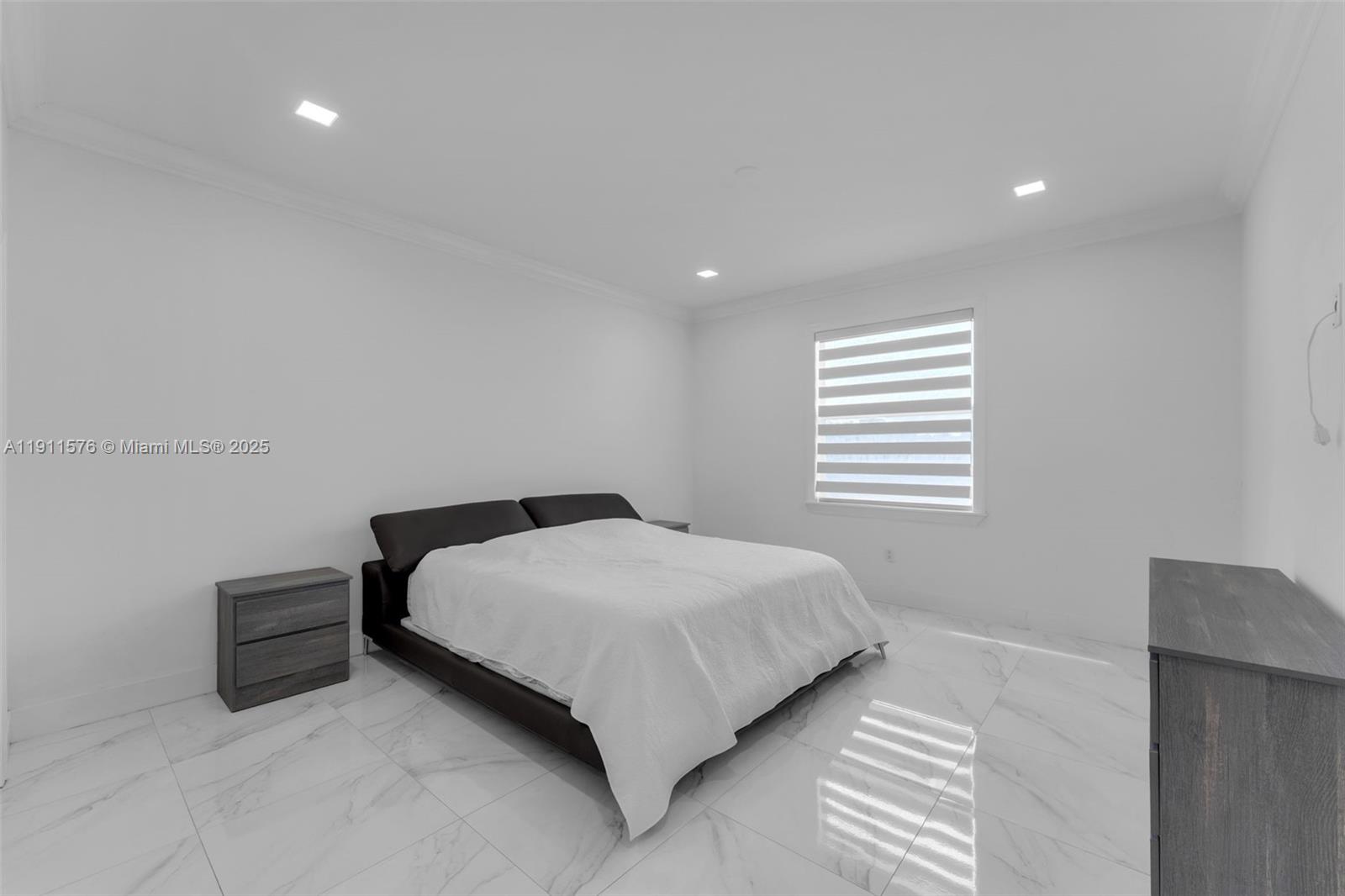 15050 Southwest 179th Avenue Miami, FL 33196 - Photo 38 of 46 a bedroom with a bed and a window