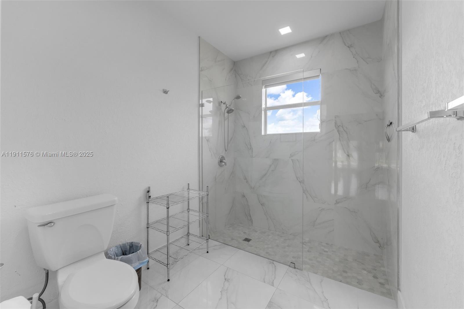 15050 Southwest 179th Avenue Miami, FL 33196 - Photo 41 of 46 a bathroom with a toilet sink and shower