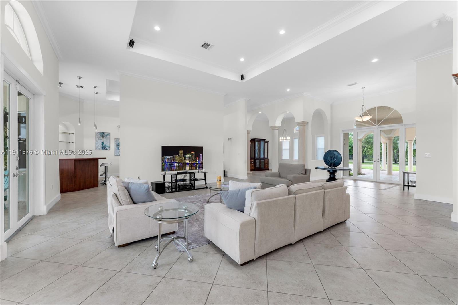 15050 Southwest 179th Avenue Miami, FL 33196 - Photo 6 of 46 a living room with furniture and a fireplace