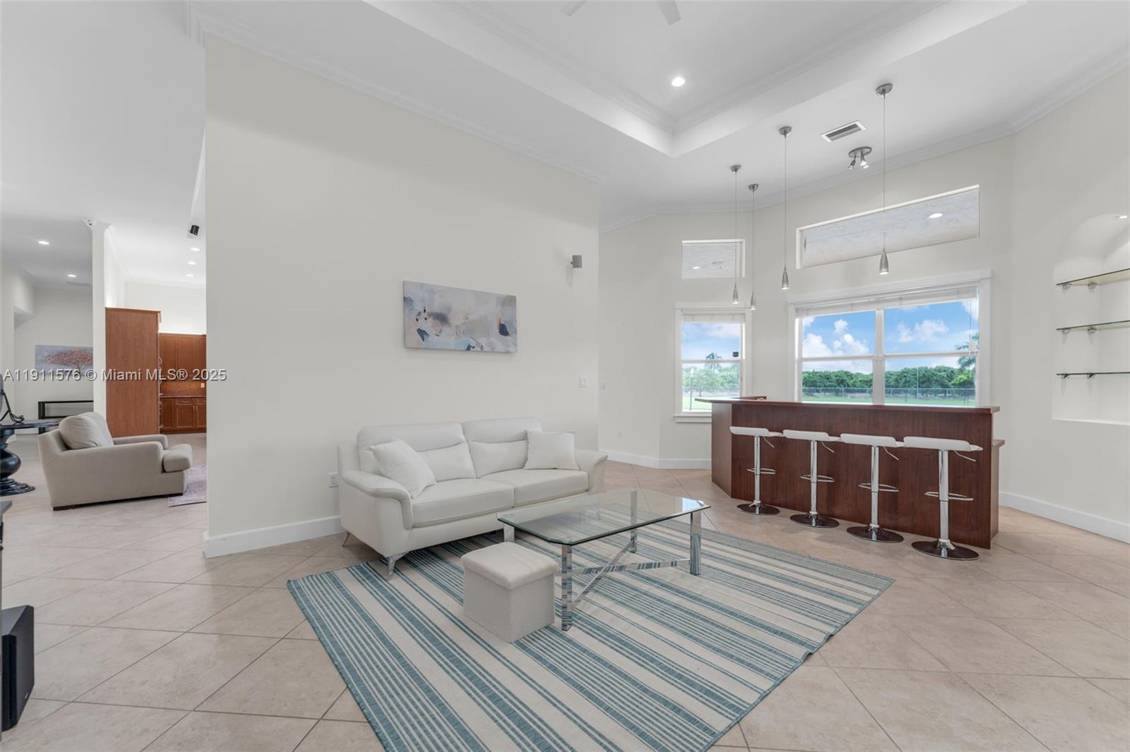 15050 Southwest 179th Avenue Miami, FL 33196 - Photo 9 of 46 a living room with furniture a window and a table