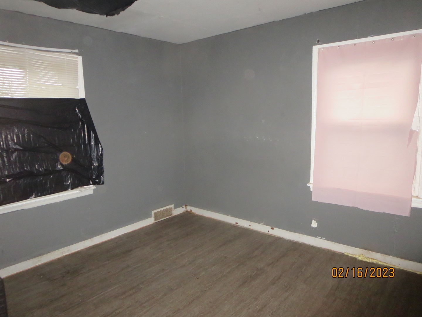 1224 East Chestnut Street Kankakee, IL 60901 - Photo 3 of 10 a view of a room with wooden floor and a window