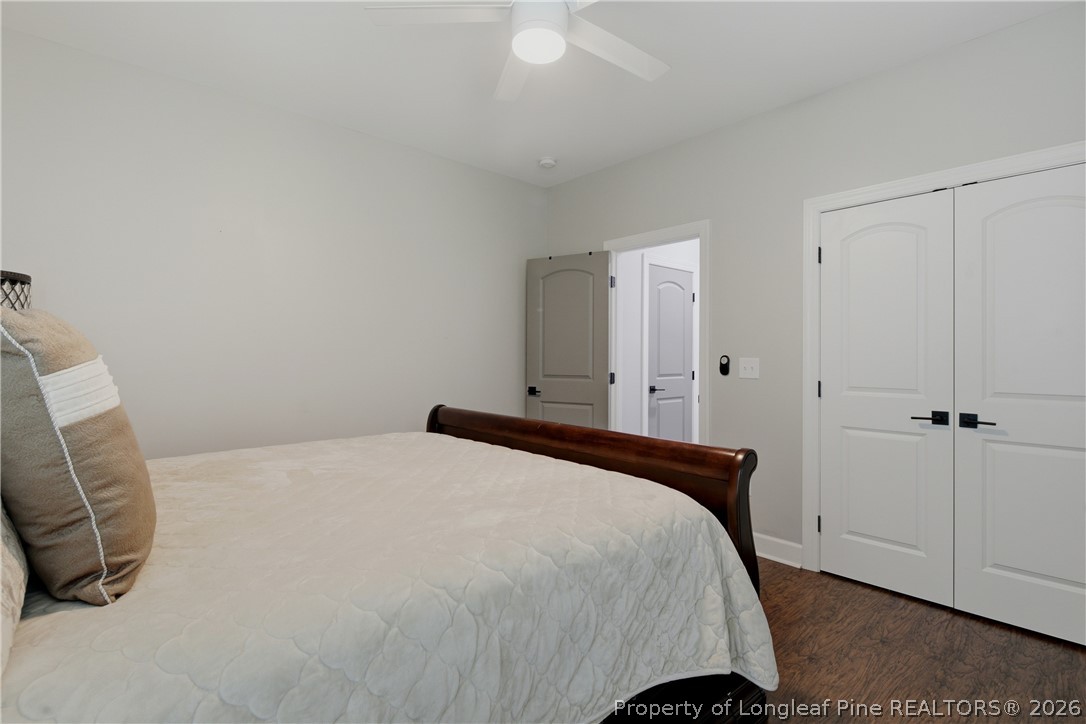 148 Heatherspring Way Spring Lake, NC 28390 - Photo 42 of 50 a bedroom with a bed and cabinets