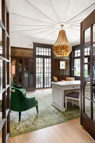 a view of entryway with furniture and wooden floor
