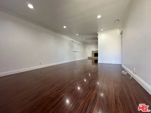 a view of a porch with garden and entryway