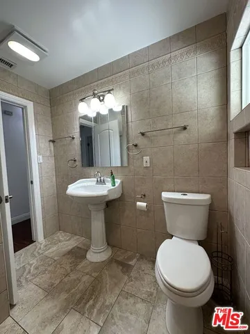 a bathroom with a shower and toilet