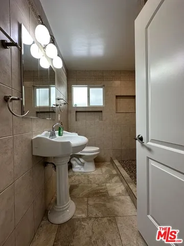 a view of a house with backyard porch and sitting area