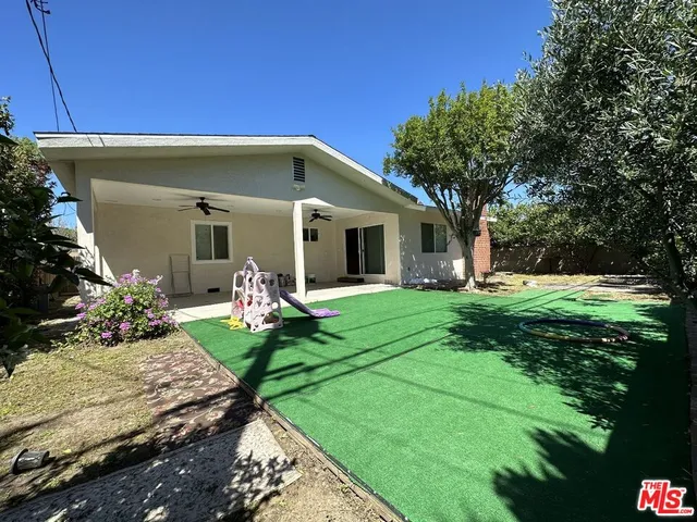 a bathroom with a toilet a sink and shower