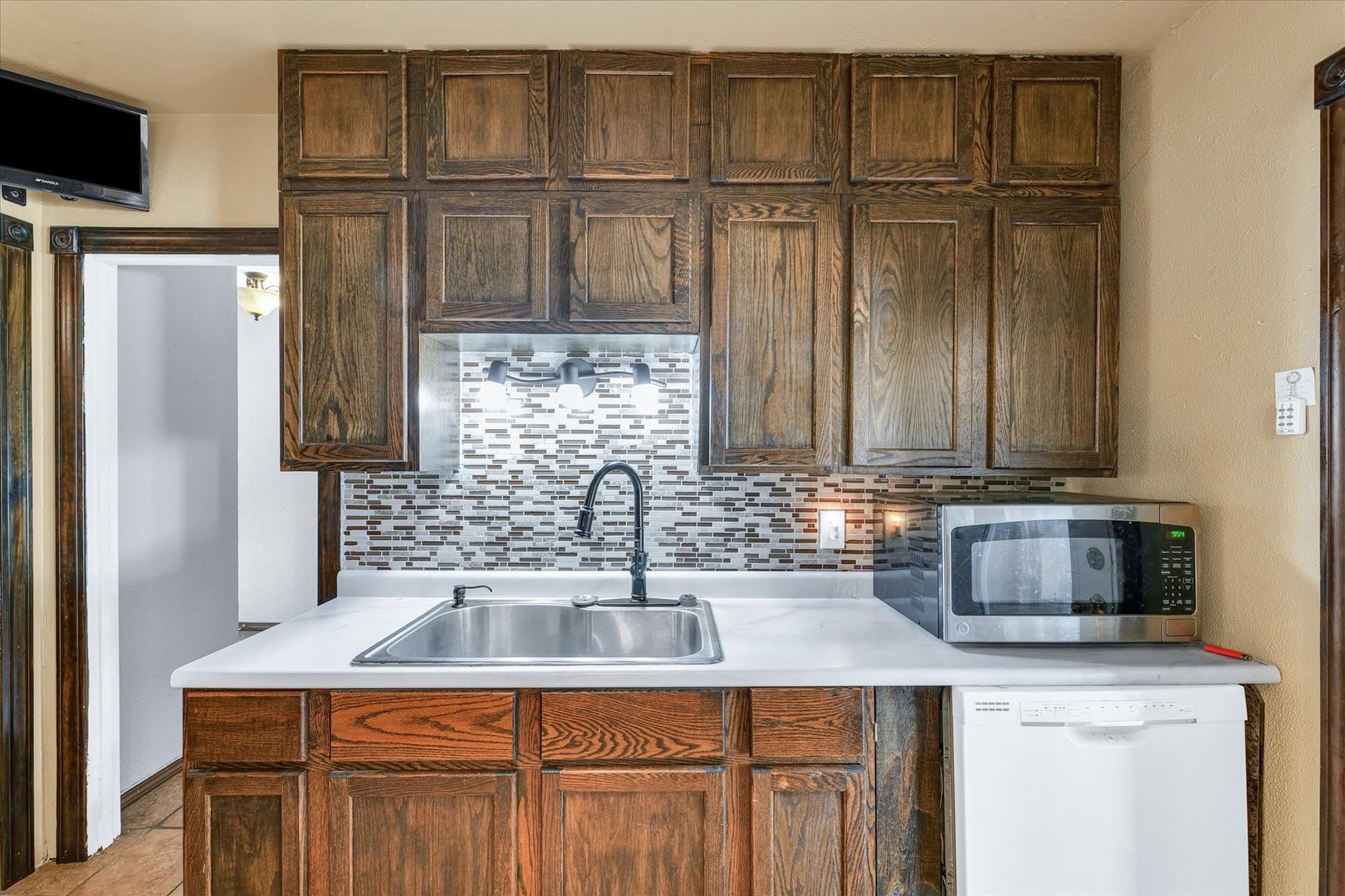 309 South Main Street Elliott, IL 60933 - Photo 19 of 44 a kitchen with a sink and a refrigerator